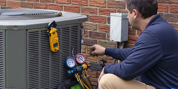 Technician working on an air conditioner