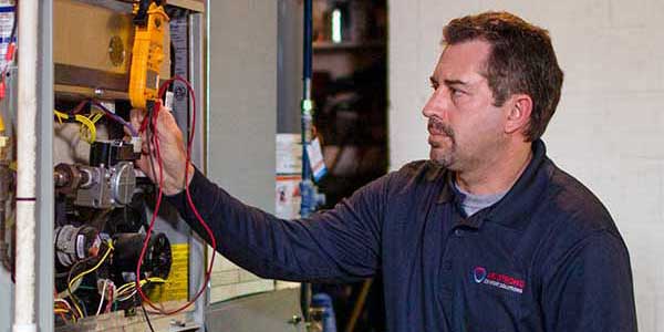 Technician testing a furnace